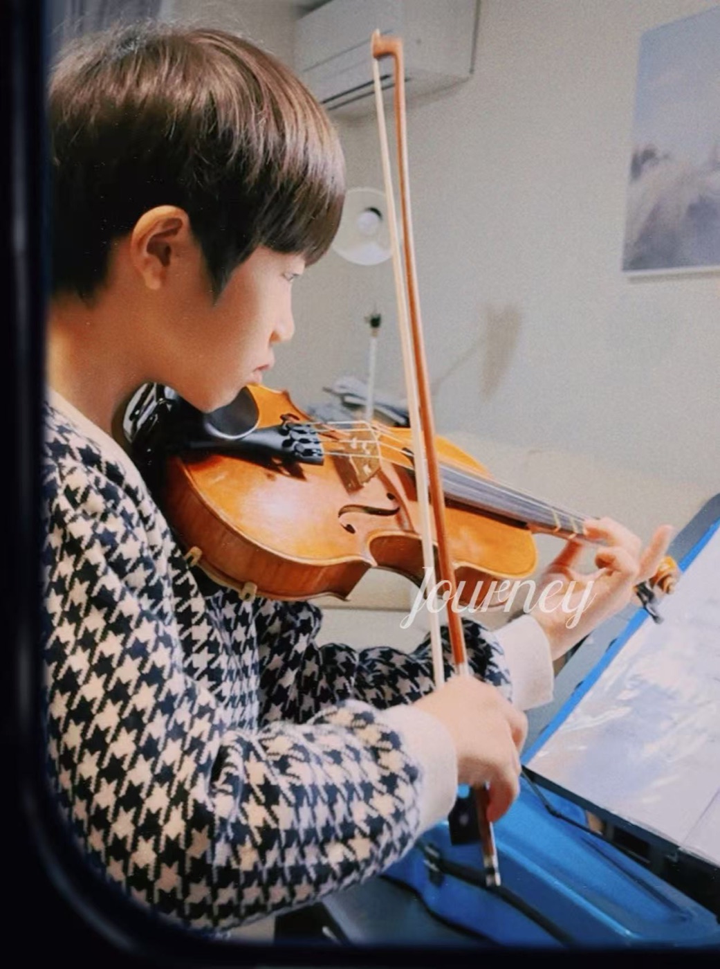 Raphael Feng practising violin