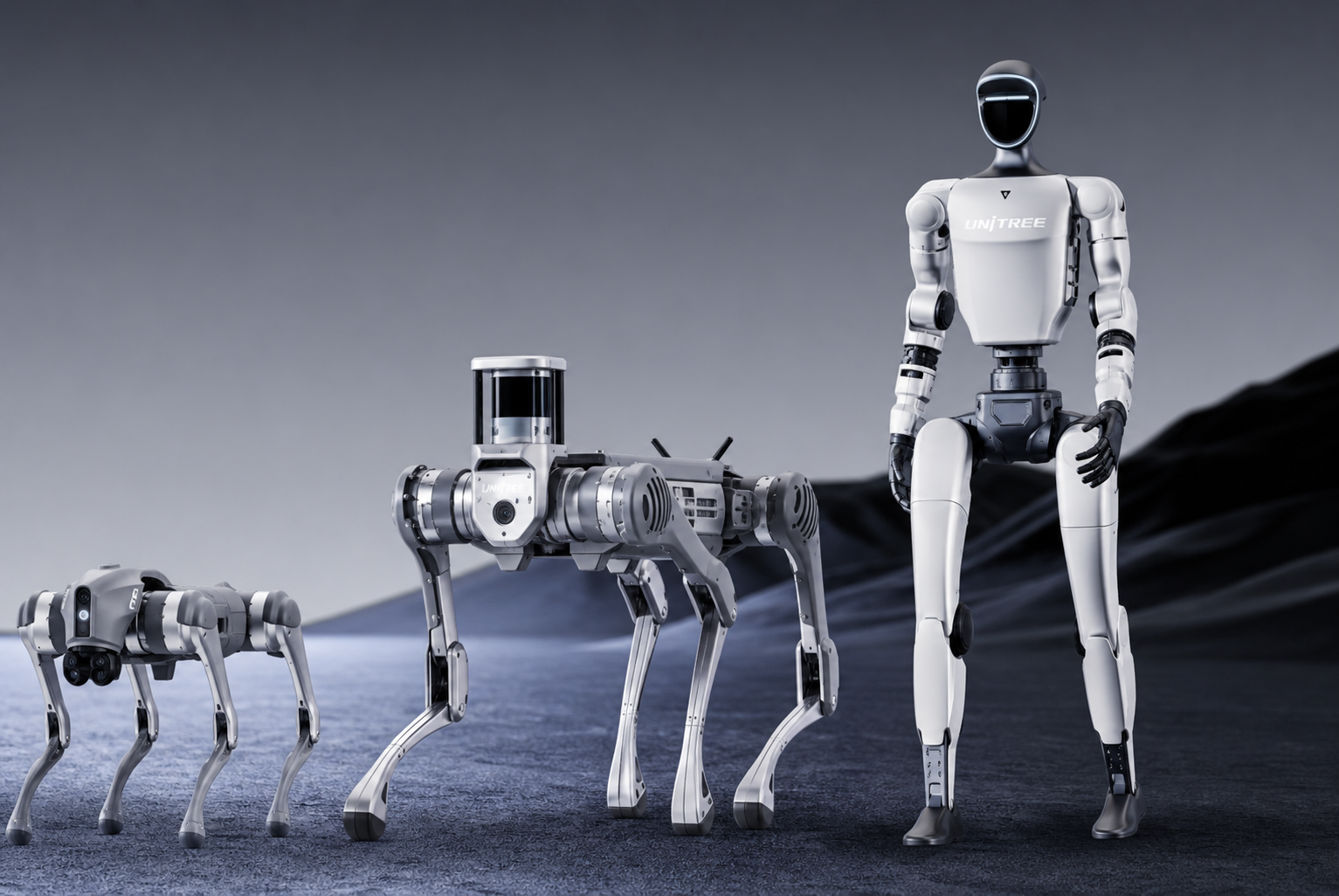Wonder Byte robotics showcase with a humanoid robot beside two Unitree robot dogs on a dark presentation floor.