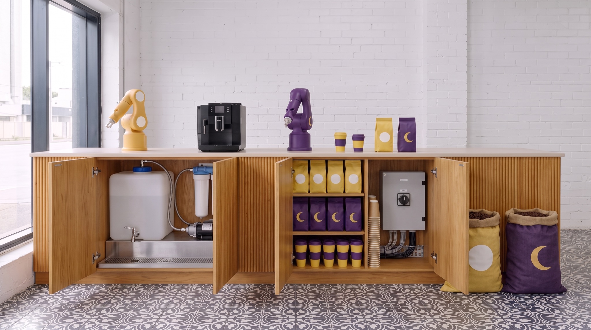 The bar with its doors open: water tank, filter and pump on the left, bagged beans and stacked cups in the middle, the switchboard on the right, bean sacks on the floor